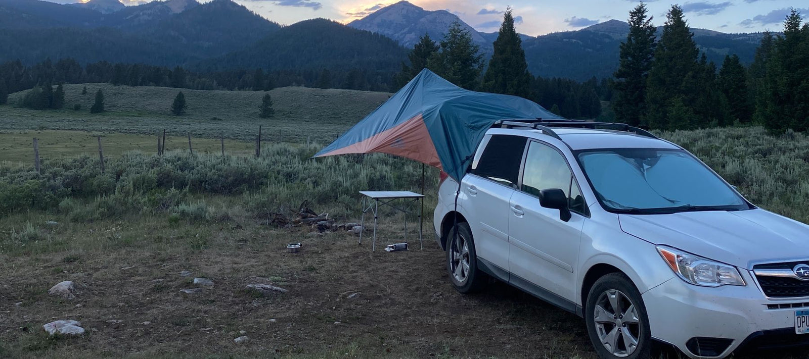 subaru with tent in the back